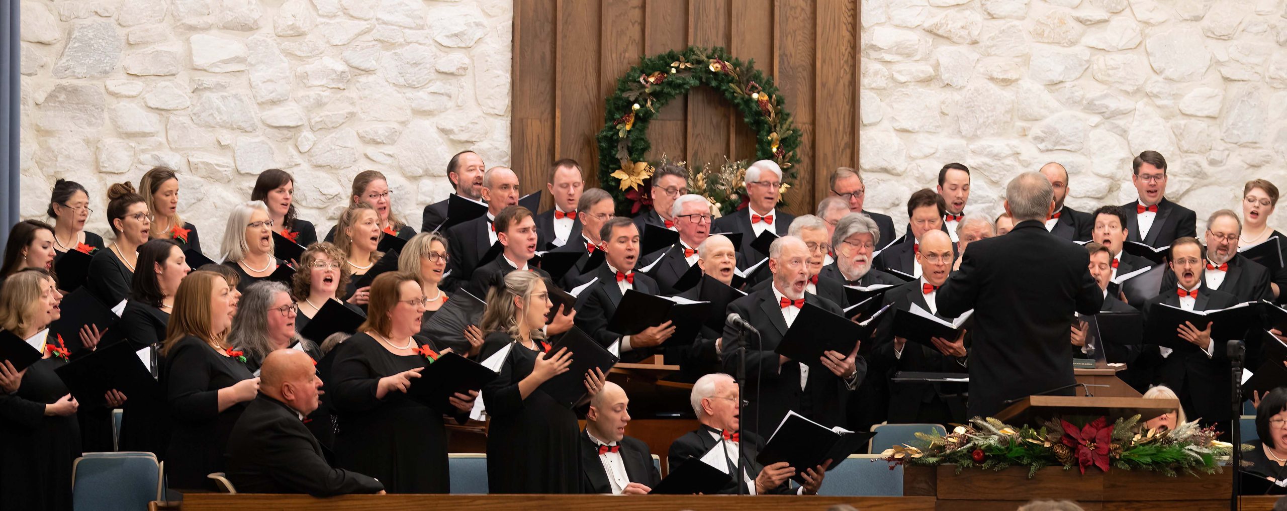 Choir singing with Christmas decorations